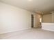 A spacious bedroom with neutral walls, carpet, and doorway at 50 Dover Ridge Ct, Chapel Hill, NC 27517