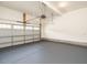 An empty garage with epoxy flooring and an automatic garage door at 50 Dover Ridge Ct, Chapel Hill, NC 27517