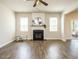 Cozy living room with a fireplace, hardwood floors, and natural light at 50 Dover Ridge Ct, Chapel Hill, NC 27517
