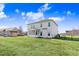 Large, fenced-in backyard with a spacious lawn, ideal for recreation and relaxation at 500 Wakefield Dr, Princeton, NC 27569