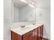 Bathroom featuring a double sink with a large mirror and updated lighting at 500 Wakefield Dr, Princeton, NC 27569