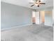 Spacious bedroom with carpet floors, ceiling fan, and two doorways at 500 Wakefield Dr, Princeton, NC 27569