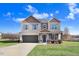 Charming two-story home featuring two-tone paint, a two-car garage, and a well-manicured front yard at 500 Wakefield Dr, Princeton, NC 27569