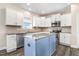 Bright kitchen with white cabinets, stainless steel appliances, granite countertops, and center island at 500 Wakefield Dr, Princeton, NC 27569