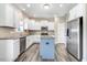 Bright kitchen with white cabinets, stainless steel appliances, granite countertops, and center island at 500 Wakefield Dr, Princeton, NC 27569