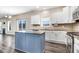 Bright kitchen with white cabinets, stainless steel appliances, granite countertops, and center island at 500 Wakefield Dr, Princeton, NC 27569