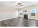 Large living room featuring a fireplace and dark wood floors, offering a cozy and inviting ambiance at 500 Wakefield Dr, Princeton, NC 27569