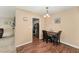 Dining area with wood floors, and views to the kitchen at 5816 Pointer Dr # 102, Raleigh, NC 27609