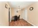 Dining room with hardwood floors, and views into the kitchen at 5816 Pointer Dr # 102, Raleigh, NC 27609