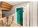 Inviting teal front door with security features and unit number displayed above the door at 5816 Pointer Dr # 102, Raleigh, NC 27609