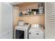 Laundry area with stacked washer and dryer and storage shelves at 5816 Pointer Dr # 102, Raleigh, NC 27609