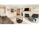 Cozy living room featuring a fireplace, modern decor, and a view into the kitchen at 5816 Pointer Dr # 102, Raleigh, NC 27609