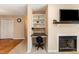 Living room area including a built in office nook next to the fireplace at 5816 Pointer Dr # 102, Raleigh, NC 27609