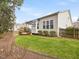 Well-maintained lawn and a small wooden deck enhance this home's backyard at 5910 Lacebark Ln, Durham, NC 27713