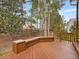 Wooden deck with integrated seating, perfect for relaxation and enjoying the backyard at 5910 Lacebark Ln, Durham, NC 27713