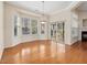 Bright dining area boasting a bay window and sliding door, leading to outdoor space at 5910 Lacebark Ln, Durham, NC 27713