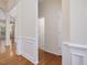 Hallway with decorative wall molding and hardwood floors at 5910 Lacebark Ln, Durham, NC 27713