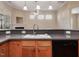 The kitchen has granite countertops, maple cabinets, and a stainless steel sink at 5910 Lacebark Ln, Durham, NC 27713