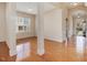 Open concept living space featuring hardwood floors, bright windows, and decorative columns at 5910 Lacebark Ln, Durham, NC 27713