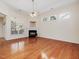 Spacious living room features hardwood floors, a fireplace, and plenty of natural light at 5910 Lacebark Ln, Durham, NC 27713