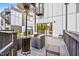 Enjoy outdoor living on this deck with its stylish furniture, heater, and convenient access to the main building at 601 Lee St, Durham, NC 27701