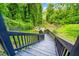 Stairs lead to a landscaped backyard with a stone fire pit at 601 Lee St, Durham, NC 27701