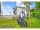 Modern home with a stairway in backyard leading to a deck and spiral staircase at 601 Lee St, Durham, NC 27701