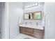 Stylish bathroom with a double vanity, sleek lighting, and modern fixtures at 601 Lee St, Durham, NC 27701