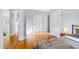 Bright bedroom with hardwood floors, neutral walls, and a modern minimalist design at 601 Lee St, Durham, NC 27701