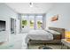 Bright bedroom features three windows offering natural light and an adjacent closet at 601 Lee St, Durham, NC 27701