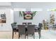 Dining area with modern table set for dinner and decorative art at 601 Lee St, Durham, NC 27701