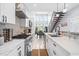 Modern kitchen features stainless steel appliances, white cabinets, and sleek countertops at 601 Lee St, Durham, NC 27701