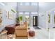 Airy living room with high ceilings, large windows, and modern furnishings at 601 Lee St, Durham, NC 27701