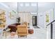 Bright living room with high ceilings, and modern furnishings at 601 Lee St, Durham, NC 27701
