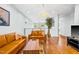 Upper-level living room with hardwood floors and view through home's open floorplan at 601 Lee St, Durham, NC 27701