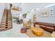 Inviting living room boasts an open staircase, high ceilings, and stylish decor at 601 Lee St, Durham, NC 27701