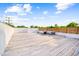 Expansive rooftop deck featuring modern outdoor furniture and a privacy fence, perfect for entertaining at 601 Lee St, Durham, NC 27701