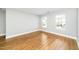 Bright bedroom features hardwood floors and a window overlooking the neighborhood at 6715 Winding Arch Dr, Durham, NC 27713