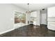 Dining area features tile flooring, a modern light fixture, and sliding glass doors to the deck at 6715 Winding Arch Dr, Durham, NC 27713
