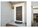 Close-up of the front door with the house number and decorative trim at 6715 Winding Arch Dr, Durham, NC 27713