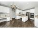 Spacious kitchen boasts an island, stainless steel appliances, tile floors, and ample cabinet space at 6715 Winding Arch Dr, Durham, NC 27713