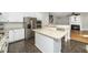 Modern kitchen featuring granite countertops, stainless steel appliances, and an island at 6715 Winding Arch Dr, Durham, NC 27713
