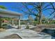 A back patio with an outdoor kitchen and grill that is great for entertaining and relaxing at 7055 Old 421 Rd, Liberty, NC 27298