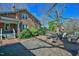 Backyard patio with seating, a fire pit, and a view of the charming brick home and barn at 7055 Old 421 Rd, Liberty, NC 27298