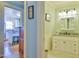 Classic bathroom with white vanity, granite countertop, and updated fixtures at 7055 Old 421 Rd, Liberty, NC 27298