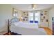 Bedroom with built-in bookshelves and a comfortable bed at 7055 Old 421 Rd, Liberty, NC 27298