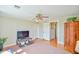 Well-lit bonus room with hardwood floors, a ceiling fan, and easy access to other living spaces at 7055 Old 421 Rd, Liberty, NC 27298