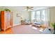 Inviting bonus room features bright windows and hardwood floors, creating a versatile and welcoming space at 7055 Old 421 Rd, Liberty, NC 27298
