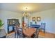 Inviting dining room featuring a chandelier, hardwood floors, and comfortable seating for six at 7055 Old 421 Rd, Liberty, NC 27298