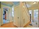 Hallway with wooden floors leading to a stairway and multiple rooms at 7055 Old 421 Rd, Liberty, NC 27298